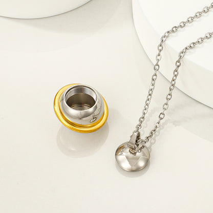 Open threaded keepsake orb pendant beside necklace chain