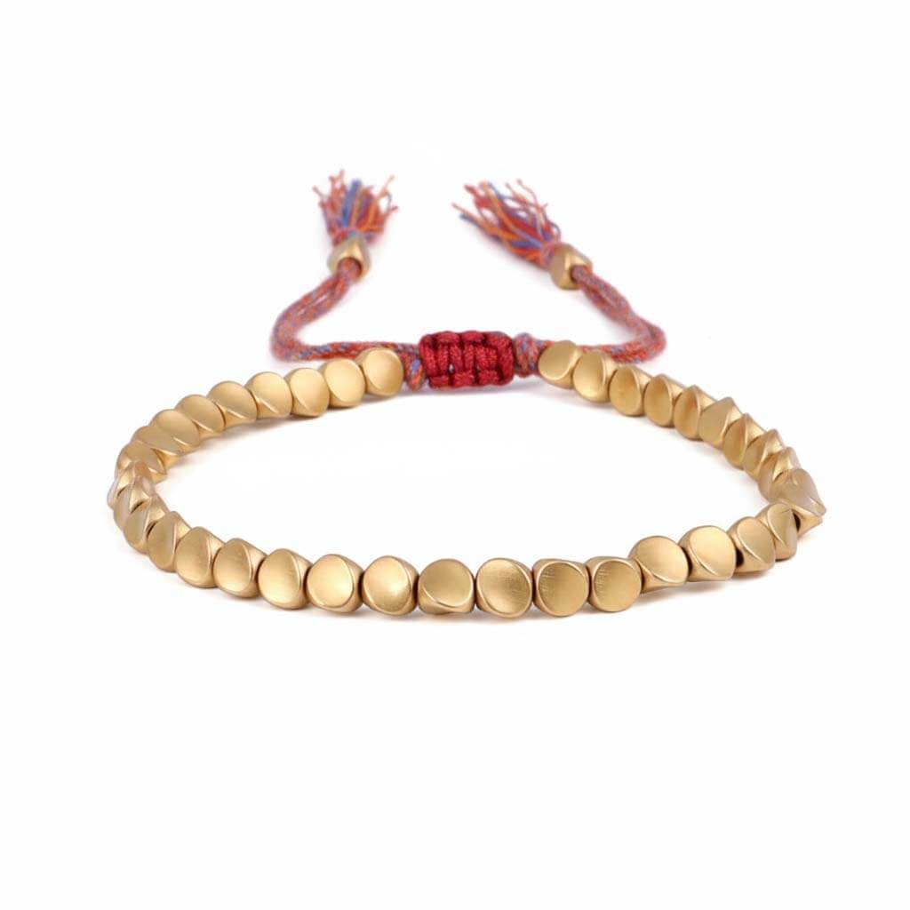 Handmade Tibetan metal beads bracelet in gold tone with colorful braided cord and decorative tassels