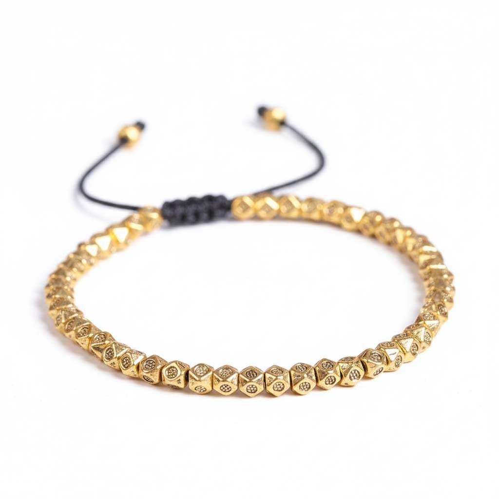 Tibetan faceted copper beads bracelet in gold tone with hand-engraved Buddhist mantra symbols on black cord