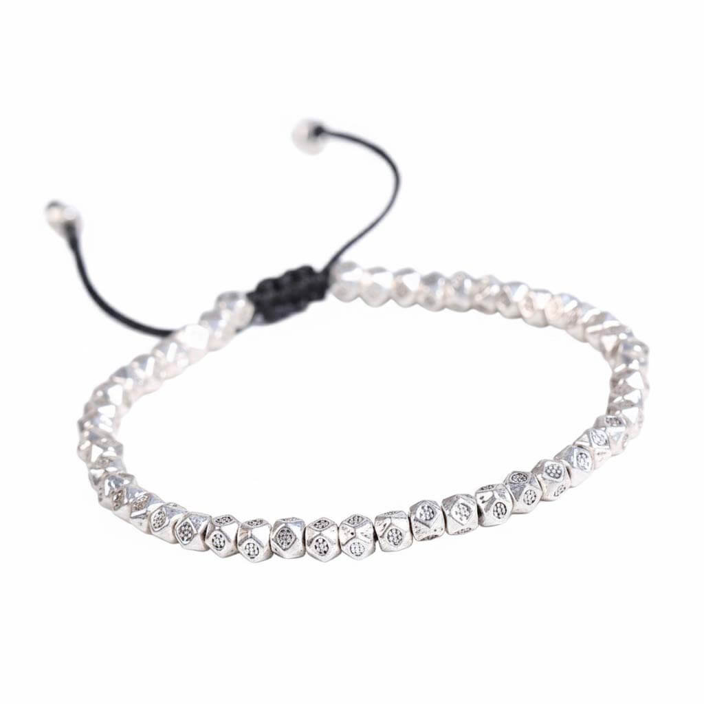 Tibetan faceted copper beads bracelet in silver tone with hand-engraved Buddhist mantra symbols on black cord