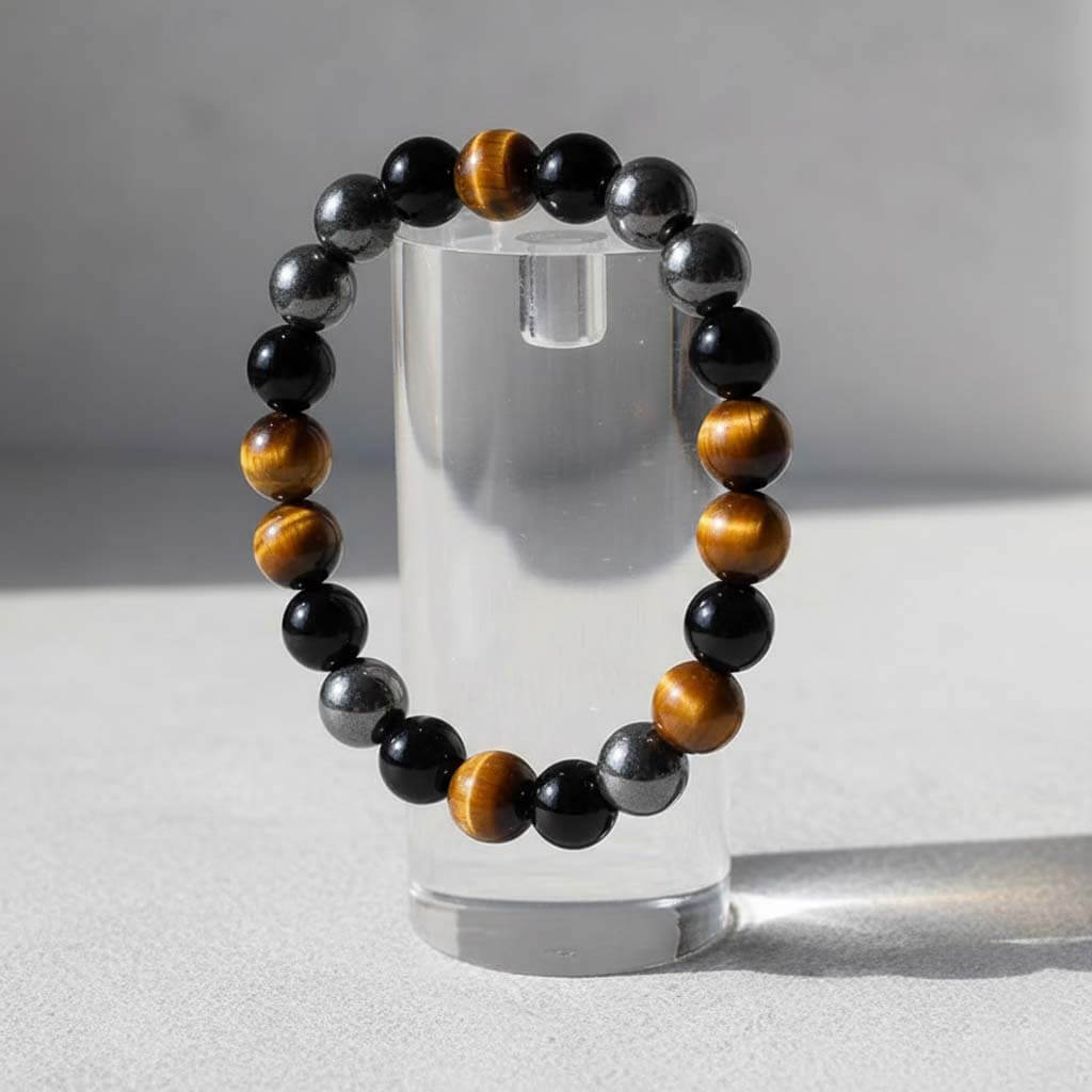 Tiger eye magnetic and agate bracelet displayed on jewelry stand showcasing chatoyant shimmer in natural light