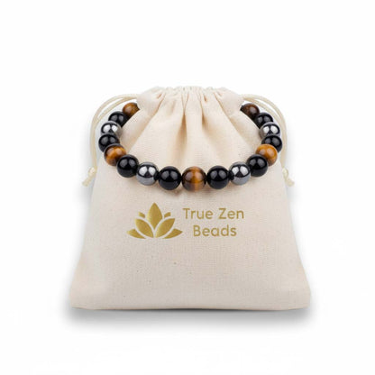 Tiger Eye, Magnetic Stone & Black Agate 8mm bracelet displayed in TrueZenBeads branded gift bag packaging with golden lotus logo - three-stone artisan jewelry ready for gifting
