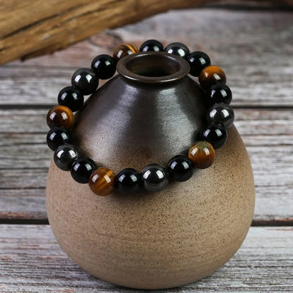 Energy bracelet with triple protection powers: Tiger Eye, Hematite, and Obsidian