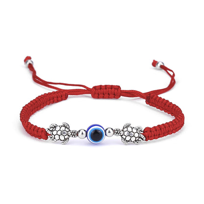 Red string evil eye bracelet with turtle charm