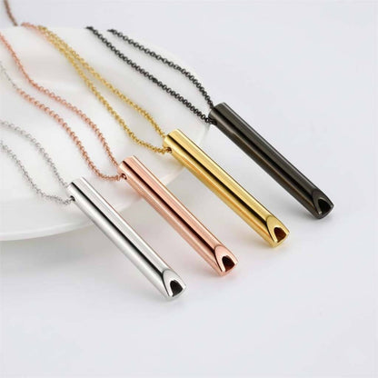 Collection of stainless steel whistle pendants in four finishes: polished steel, rose gold, gold tone, and matte black featuring 60mm cylindrical designs