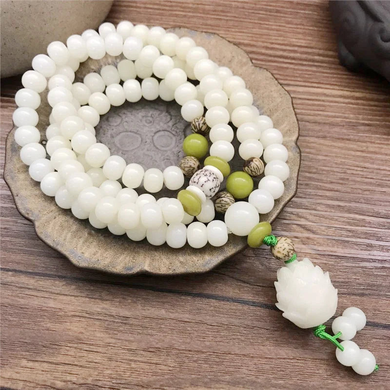 Wrap-around white Bodhi seed bracelet used for yoga and daily reflection