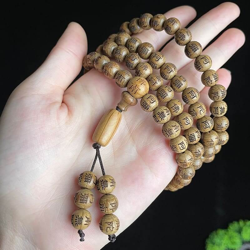 108 wood bead strand wrapped multiple times around the wrist for a stacked layered bracelet style